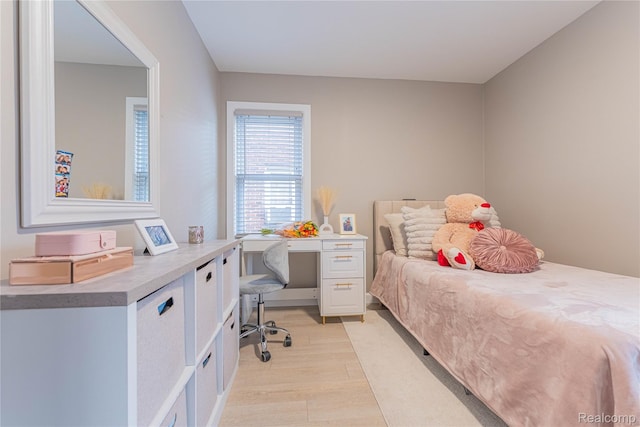 2544 S Beatrice St, Detroit, MI 48217 - bedroom with light wood-style flooring and a desk