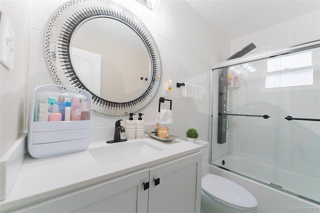 2544 S Beatrice St, Detroit, MI 48217 - bathroom with vanity, combined bath / shower with glass door, backsplash, and tile walls