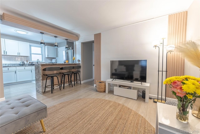 2544 S Beatrice St, Detroit, MI 48217 - living room featuring light wood-style floors and baseboards