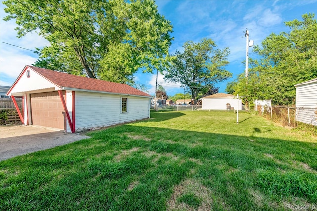 22610 Karam Ct, Macomb, MI 48091 - view of yard featuring an outdoor structure and a garage