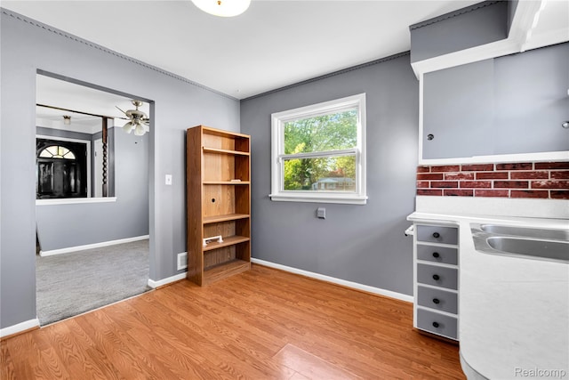 22610 Karam Ct, Macomb, MI 48091 - unfurnished office with light wood-style flooring, ceiling fan, and crown molding