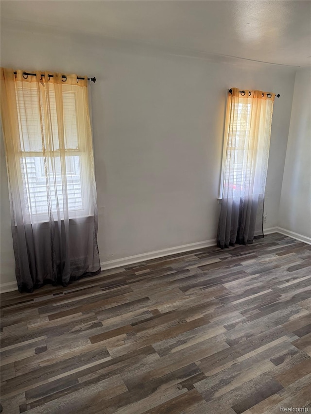 18824 Helen St, Detroit, MI 48234 - spare room featuring dark wood-style flooring and baseboards