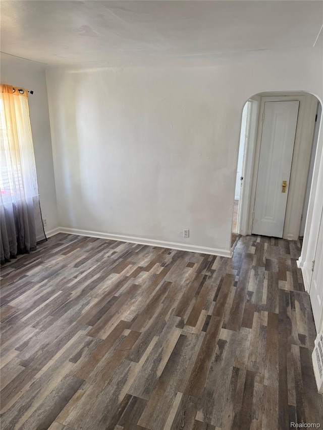 18824 Helen St, Detroit, MI 48234 - unfurnished room featuring arched walkways and wood finished floors
