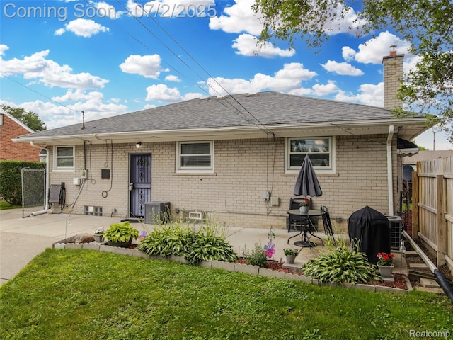 4910 Julius Blvd, Westland, MI 48186 - back of house with a chimney, brick siding, a patio, and a shingled roof