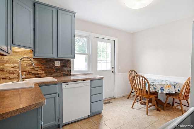 23631 Beverly St, Saint Clair Shores, MI 48082 - kitchen with dishwasher, wainscoting, gray cabinetry, light tile patterned floors, and decorative backsplash