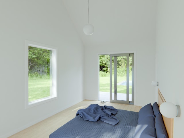 15660 Locke Rd, Union Pier, MI 49129 - bedroom featuring multiple windows, wood finished floors, and a towering ceiling