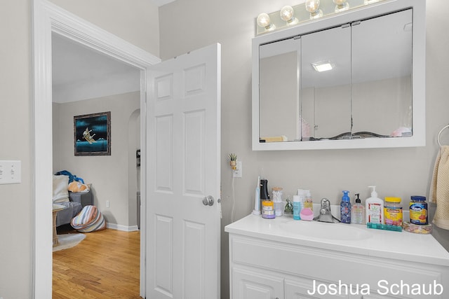 908 Chatham St NW, Grand Rapids, MI 49504 - bathroom featuring vanity and wood finished floors