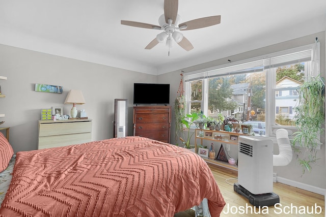 908 Chatham St NW, Grand Rapids, MI 49504 - bedroom featuring wood finished floors, multiple windows, and ceiling fan