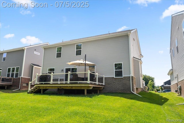 21422 Navarra Dr, South Lyon, MI 48178 - rear view of house with a wooden deck, brick siding, and a yard