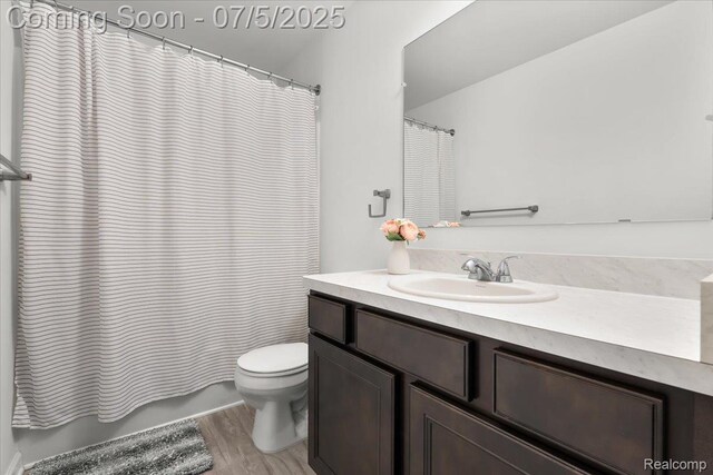 21422 Navarra Dr, South Lyon, MI 48178 - bathroom featuring vanity, wood finished floors, and curtained shower