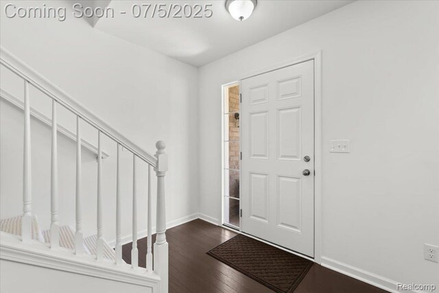 21422 Navarra Dr, South Lyon, MI 48178 - foyer featuring dark wood-style flooring and stairs