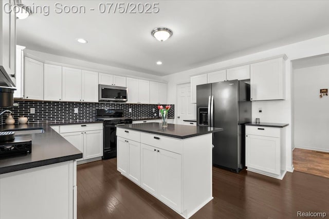 21422 Navarra Dr, South Lyon, MI 48178 - kitchen with appliances with stainless steel finishes, dark countertops, decorative backsplash, dark wood-style flooring, and recessed lighting