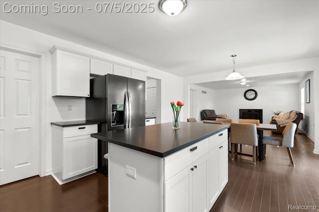 21422 Navarra Dr, South Lyon, MI 48178 - kitchen featuring dark countertops, dark wood finished floors, and open floor plan