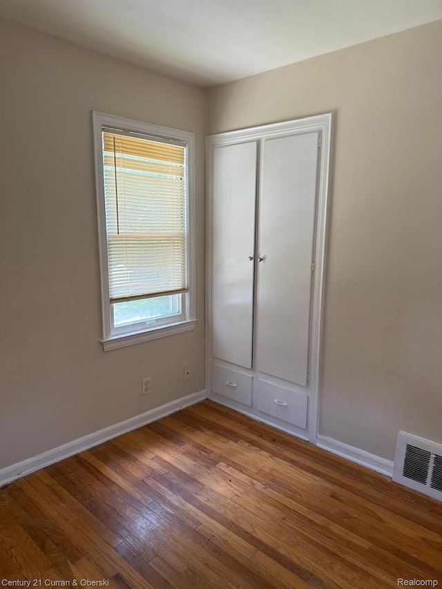 10056 Garfield, Redford, MI 48239 - unfurnished bedroom with wood finished floors and a closet