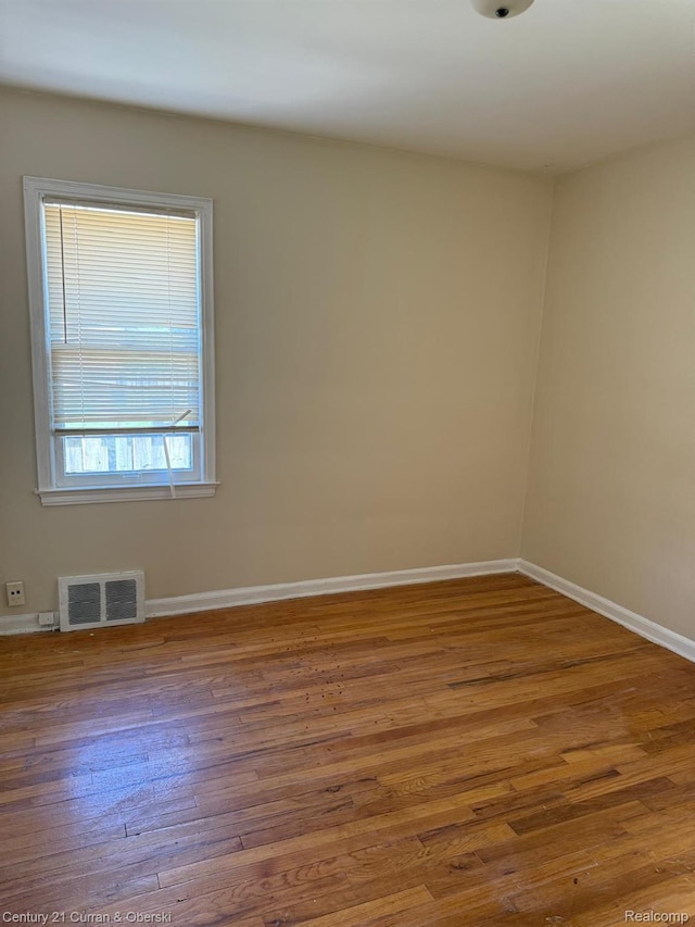 10056 Garfield, Redford, MI 48239 - spare room featuring wood finished floors and baseboards