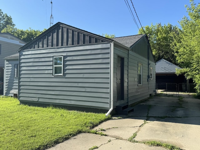 3355 Lyndon Ave, Flint, MI 48504 - view of side of home featuring board and batten siding