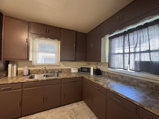 3355 Lyndon Ave, Flint, MI 48504 - kitchen with black microwave and tile counters