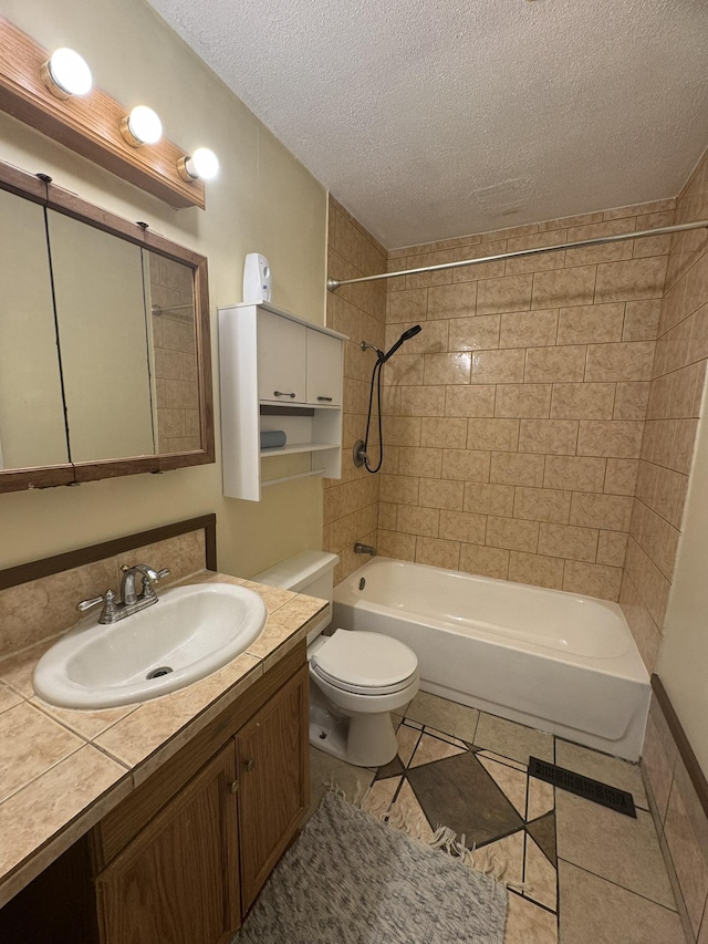 3355 Lyndon Ave, Flint, MI 48504 - bathroom with shower / washtub combination, a textured ceiling, vanity, and tile patterned floors