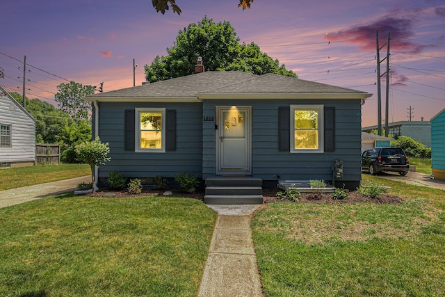 1816 Jennette Ave NW, Grand Rapids, MI 49504 - bungalow featuring a lawn, a chimney, and a shingled roof