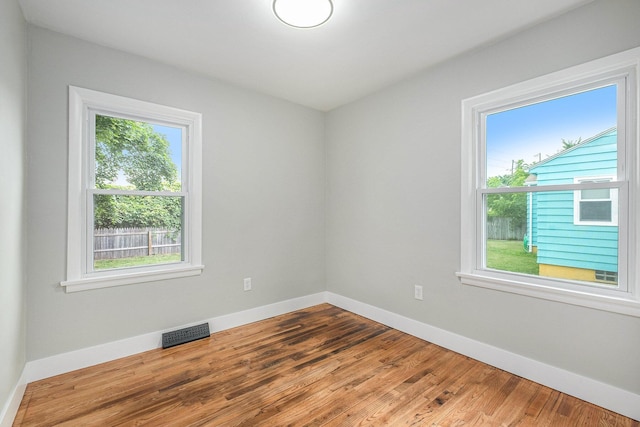 1816 Jennette Ave NW, Grand Rapids, MI 49504 - empty room featuring healthy amount of natural light and wood finished floors