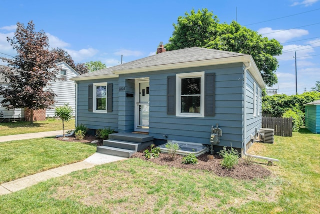 1816 Jennette Ave NW, Grand Rapids, MI 49504 - bungalow-style house with a chimney and roof with shingles
