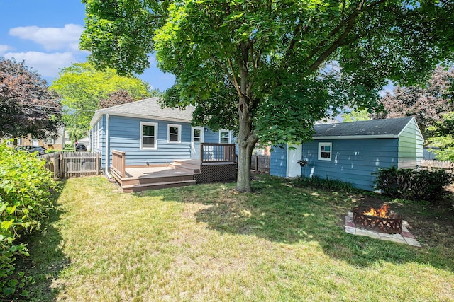 1816 Jennette Ave NW, Grand Rapids, MI 49504 - back of house with an outdoor fire pit and a deck