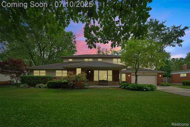 1304 Midland Blvd, Royal Oak, MI 48073 - prairie-style house with a front lawn, driveway, and an attached garage