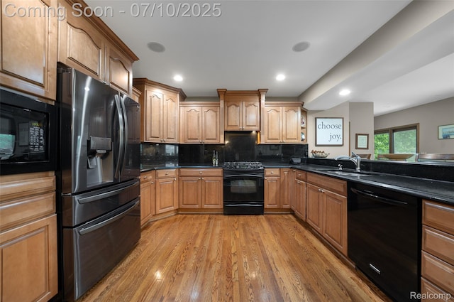 1304 Midland Blvd, Royal Oak, MI 48073 - kitchen featuring black appliances, light wood-style flooring, dark countertops, backsplash, and recessed lighting
