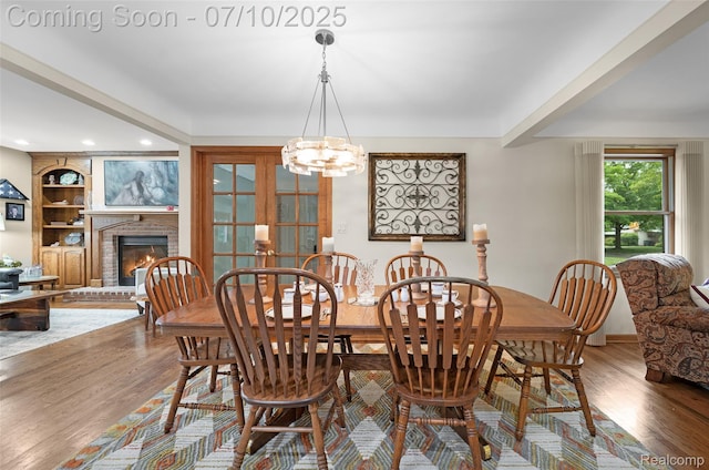 1304 Midland Blvd, Royal Oak, MI 48073 - dining room with wood finished floors, a fireplace, a chandelier, recessed lighting, and built in shelves