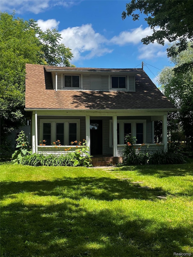 8956 Dixie Hwy, Ira, MI 48023 - view of front facade with a front lawn and covered porch