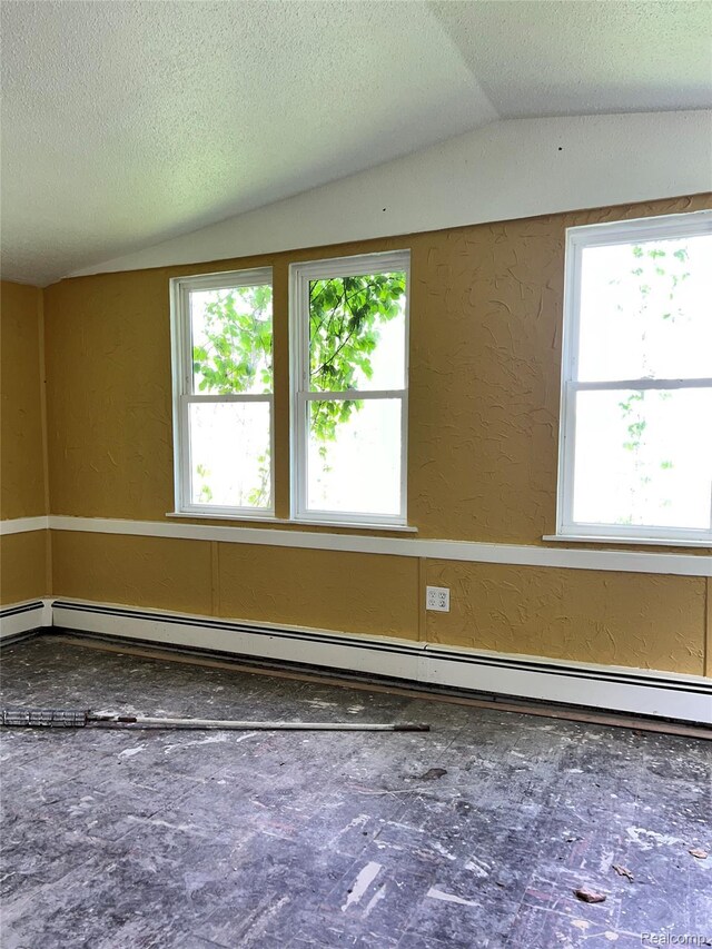 8956 Dixie Hwy, Ira, MI 48023 - spare room with a textured wall, plenty of natural light, vaulted ceiling, a textured ceiling, and a baseboard radiator