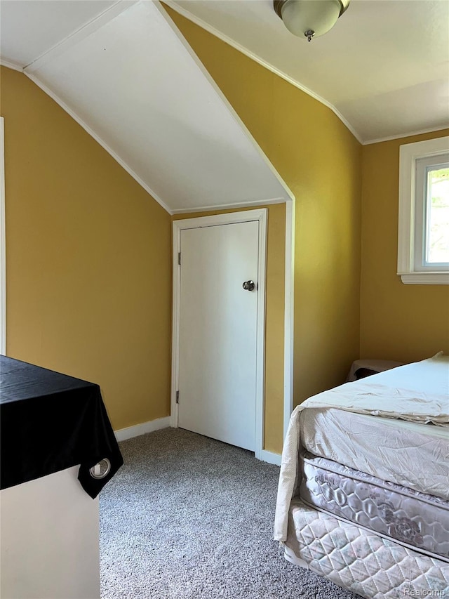 8956 Dixie Hwy, Ira, MI 48023 - carpeted bedroom with lofted ceiling and baseboards