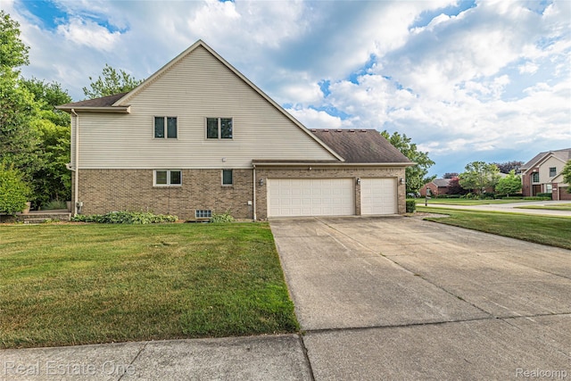 51992 Boland Rd, Chesterfield, MI 48047 - view of property exterior featuring an attached garage, a yard, driveway, and brick siding
