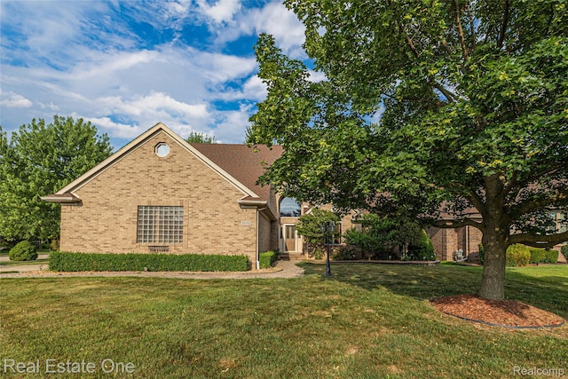 51992 Boland Rd, Chesterfield, MI 48047 - view of front of property featuring brick siding and a front lawn