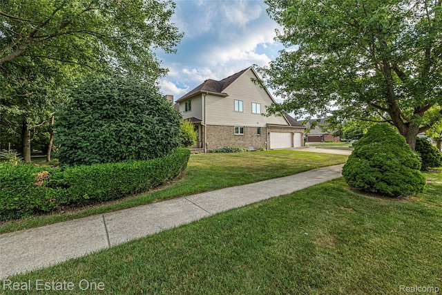 51992 Boland Rd, Chesterfield, MI 48047 - view of side of property featuring brick siding, driveway, and a yard