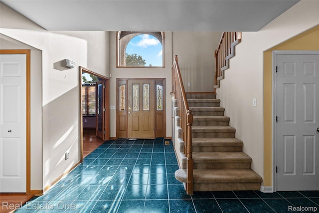 51992 Boland Rd, Chesterfield, MI 48047 - entrance foyer with stairway and dark tile patterned floors