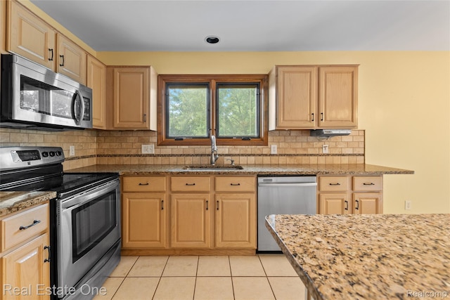 51992 Boland Rd, Chesterfield, MI 48047 - kitchen with stainless steel appliances, light brown cabinetry, light tile patterned flooring, and decorative backsplash