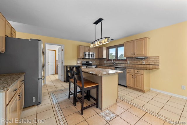 51992 Boland Rd, Chesterfield, MI 48047 - kitchen with appliances with stainless steel finishes, light tile patterned floors, backsplash, and a kitchen breakfast bar