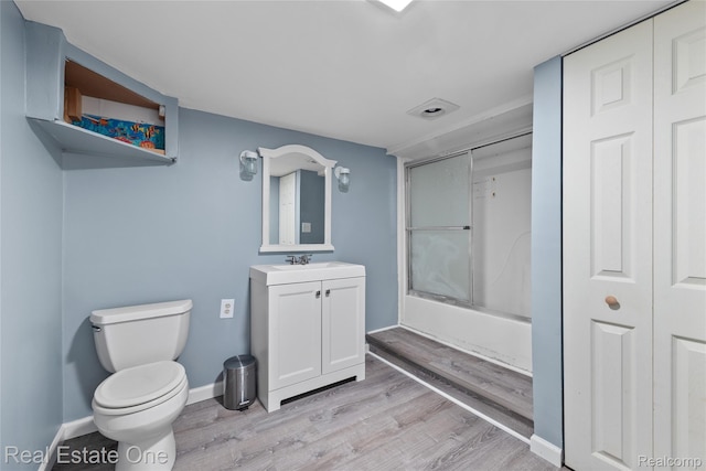 51992 Boland Rd, Chesterfield, MI 48047 - full bath featuring vanity, wood finished floors, and enclosed tub / shower combo