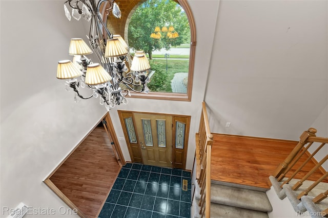 51992 Boland Rd, Chesterfield, MI 48047 - tiled entryway featuring a chandelier and stairway