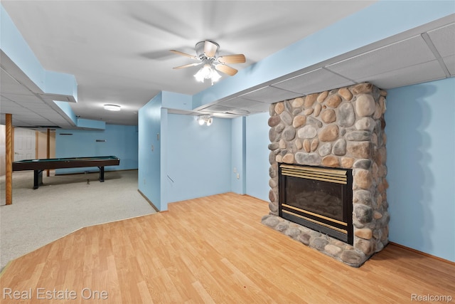 51992 Boland Rd, Chesterfield, MI 48047 - finished below grade area with a stone fireplace, billiards table, wood finished floors, and a drop ceiling