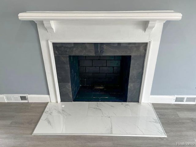 4651 Berkshire St, Detroit, MI 48224 - detailed view of a fireplace and wood finished floors