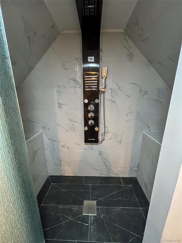 4651 Berkshire St, Detroit, MI 48224 - bathroom featuring a tile shower, marble finish flooring, and stone wall