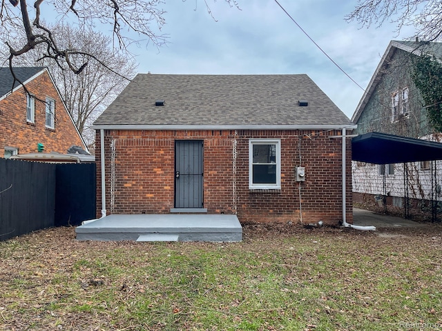 4651 Berkshire St, Detroit, MI 48224 - back of house featuring brick siding and roof with shingles