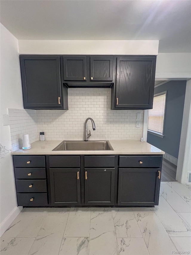 4651 Berkshire St, Detroit, MI 48224 - kitchen with light marble finish flooring, light countertops, and tasteful backsplash