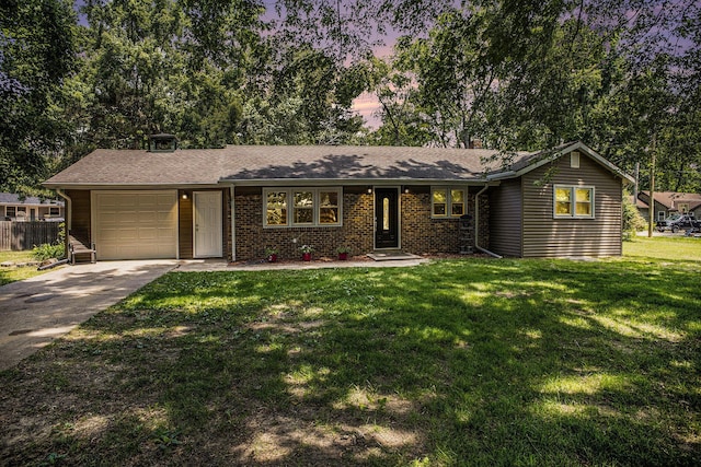 3341 Circle Dr, Saint Joseph, MI 49085 - ranch-style house with a front yard, an attached garage, and concrete driveway
