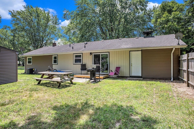 3341 Circle Dr, Saint Joseph, MI 49085 - rear view of house with a chimney and roof with shingles