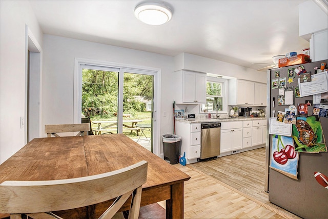 3341 Circle Dr, Saint Joseph, MI 49085 - kitchen with appliances with stainless steel finishes, white cabinets, and light wood-style floors