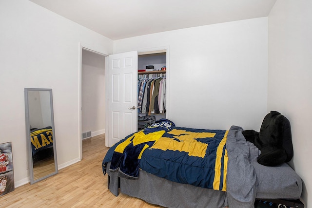 3341 Circle Dr, Saint Joseph, MI 49085 - bedroom featuring wood finished floors and a closet