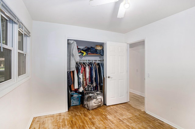 3341 Circle Dr, Saint Joseph, MI 49085 - bedroom with wood finished floors, a closet, and ceiling fan